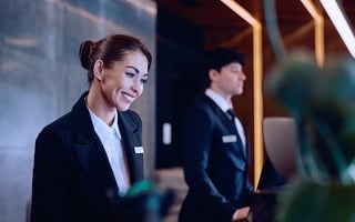 a woman working at a hotel reception 